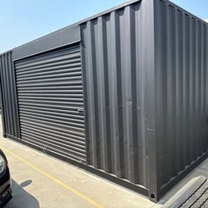 20ft Used Shipping Container with Matte Black Finish and 12ft Side Roll-Up Door
